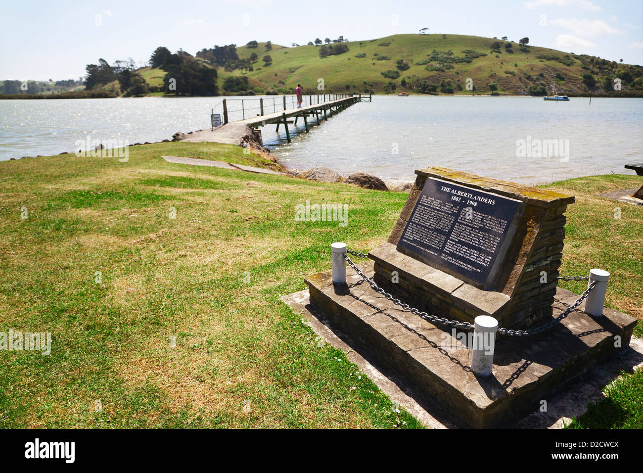 The wharf at Port Albert and a commemorative plaque for the pioneers, Albertlanders. Wellsford, North Island, New Zealand. Stock Photo
