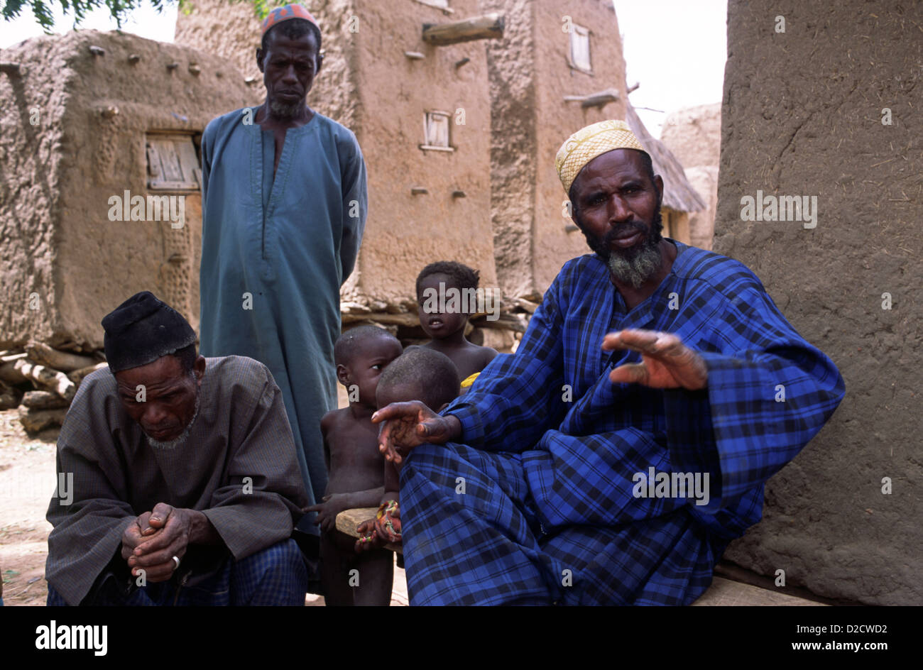 A group of elders in a village on the Dogon plateau in Mali, West Africa. They are wearing traditional caftans called boubous. Stock Photo