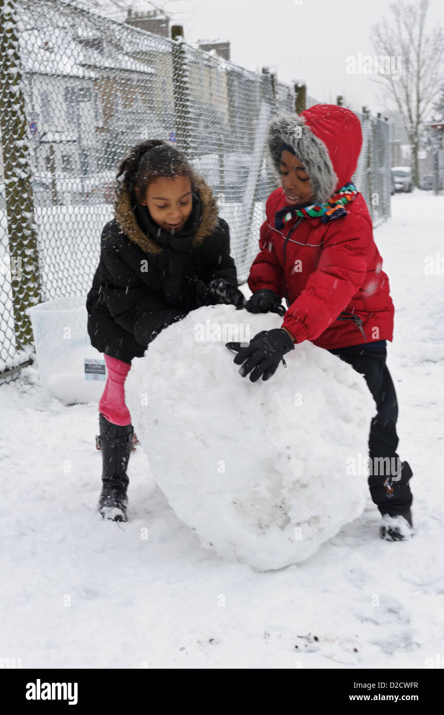 Rolling a big snowball hires stock photography and images Alamy