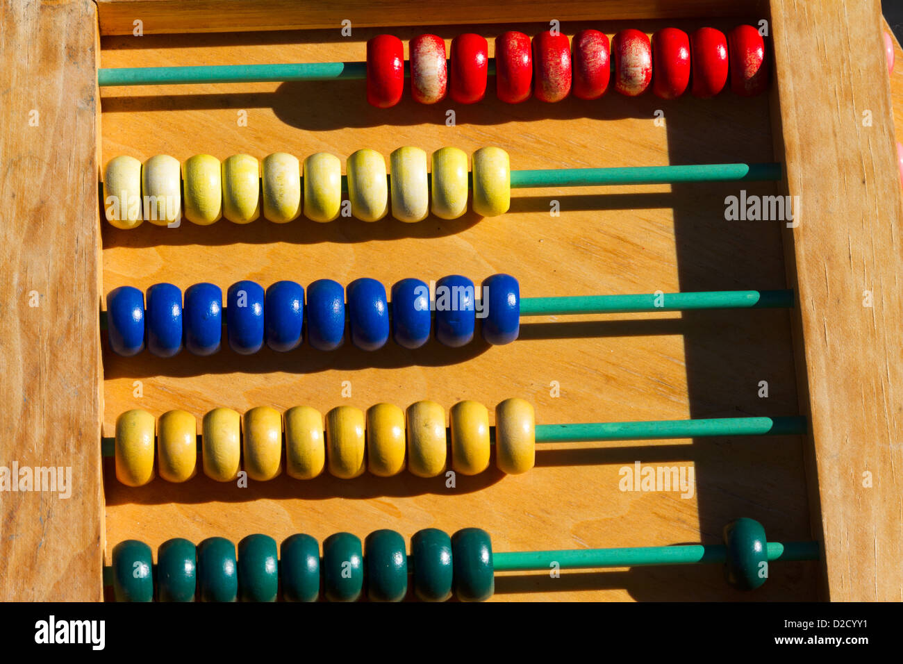 A toy abacus with brightly colored counters and rods. Stock Photo