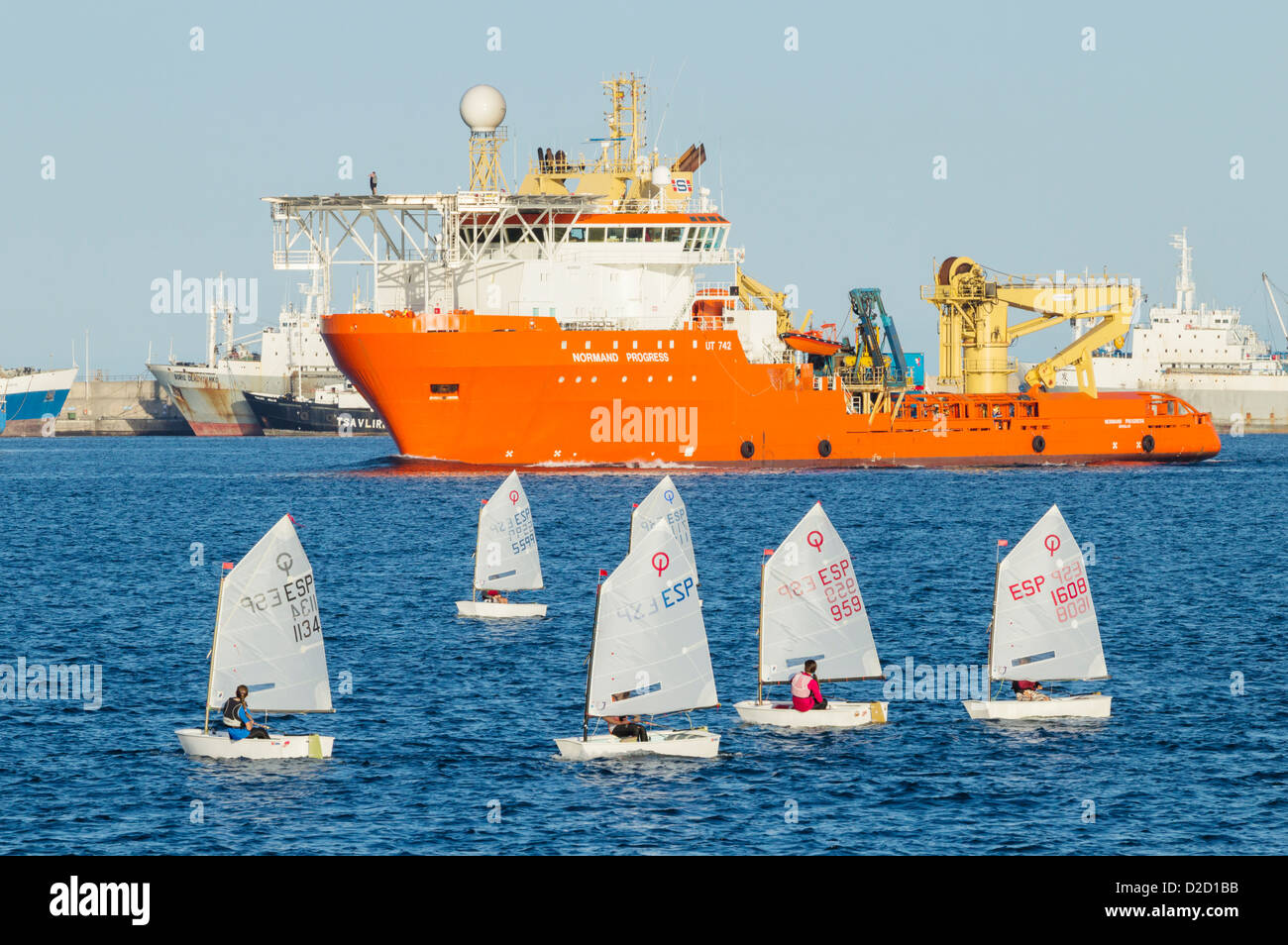 Optimist dinghies sailing in Las Palmas port on Gran Canaria Stock