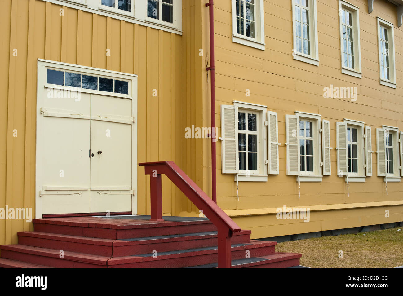 Front side of the Russian House showing windows and door in