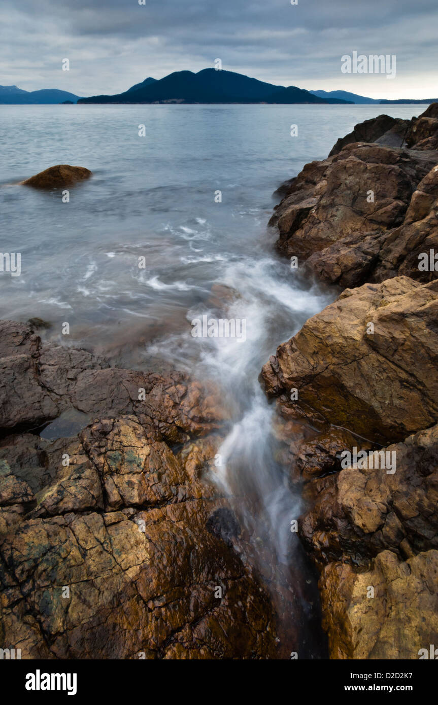 Waves wash up on Green Point, Washington Park, Anacortes, Fidalgo Island, Washington, USA Stock Photo