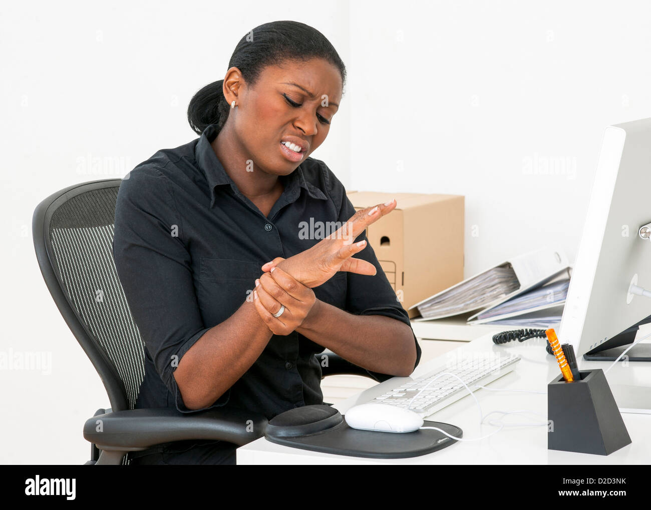 MODEL RELEASED Repetitive strain injury RSI Stock Photo