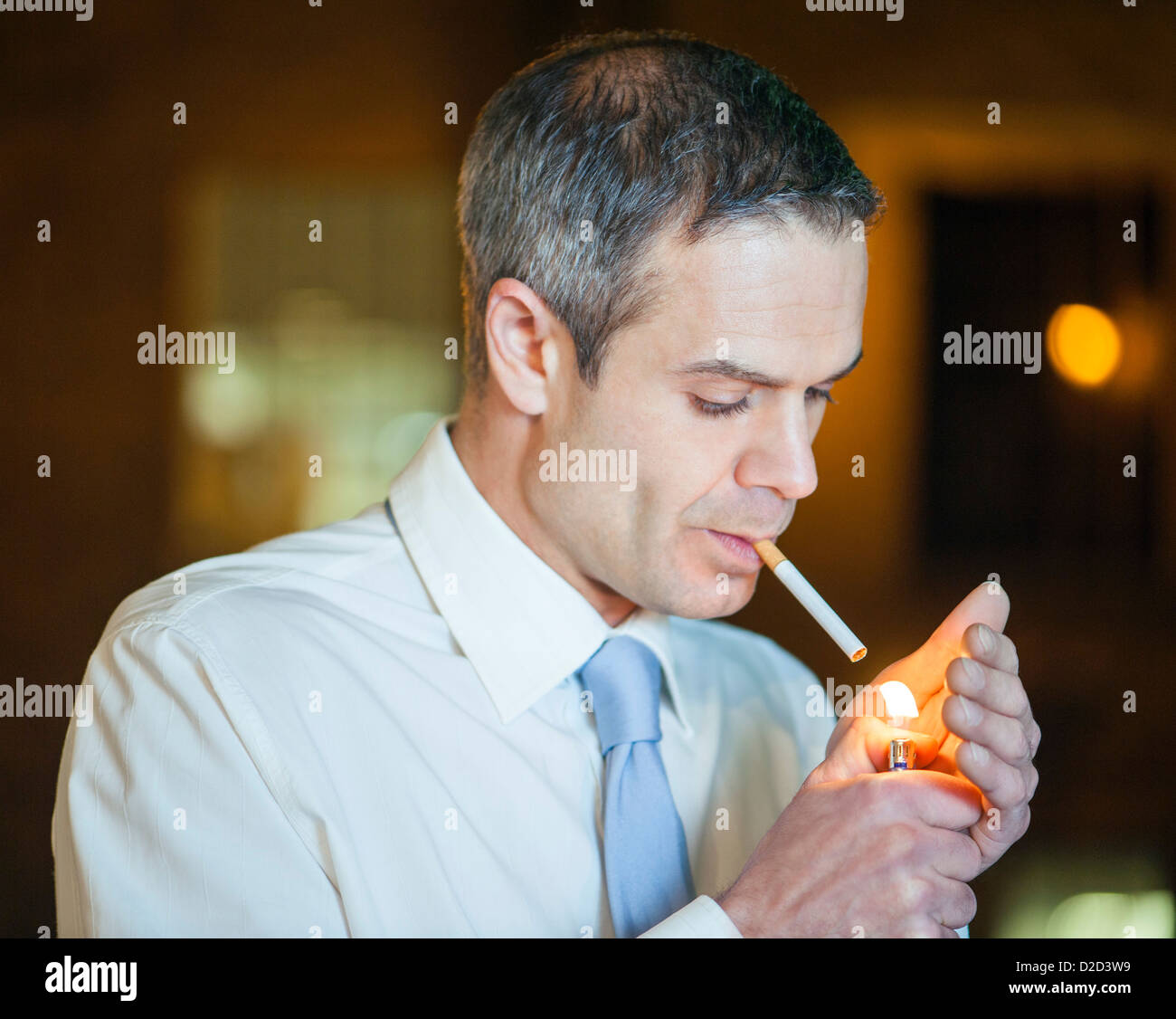 Man lighting cigarette hi-res stock photography and images