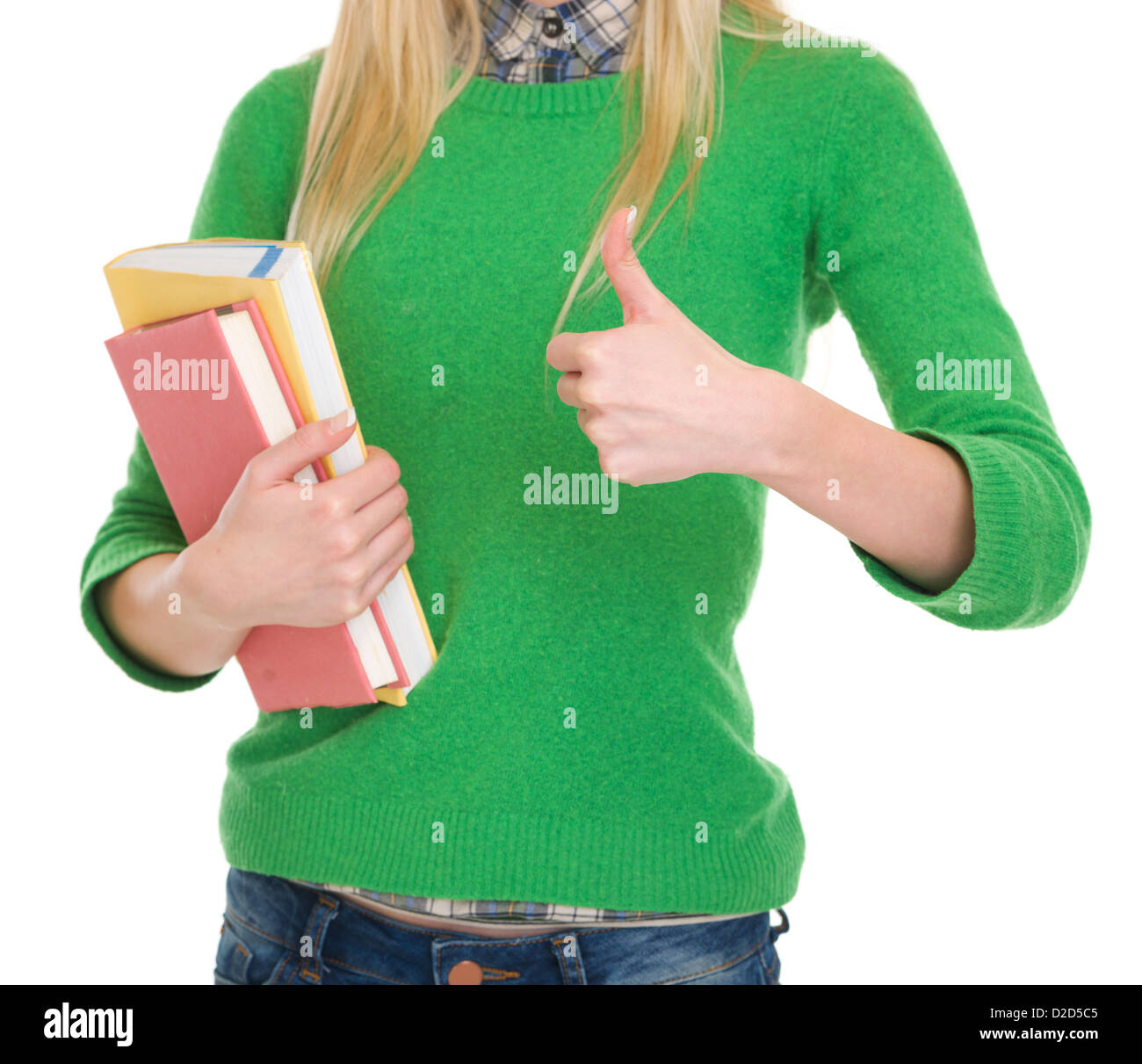 Closeup on student girl with books showing thumbs up Stock Photo - Alamy