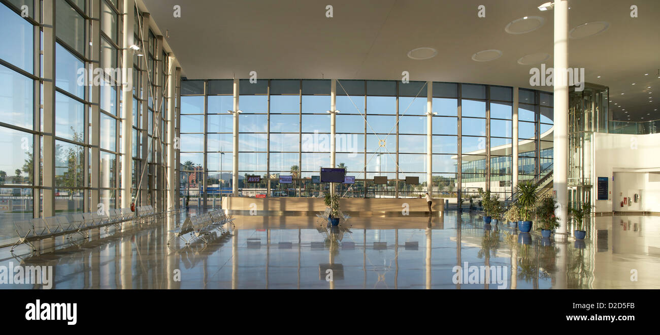 Gibraltar Airport, Gibraltar, United Kingdom. Architect: Bblur Architecture, 2012. Glazed, double-height departure hall panorama Stock Photo