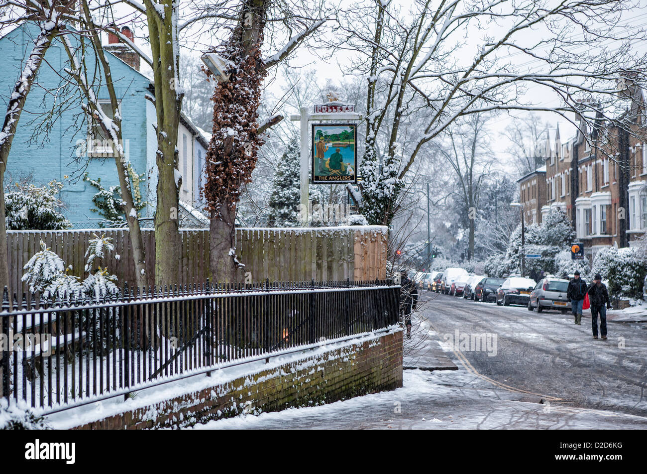 Sign of 'The Anglers' pub in Ferry Road covered in snow in Winter - Teddington, UK Stock Photo