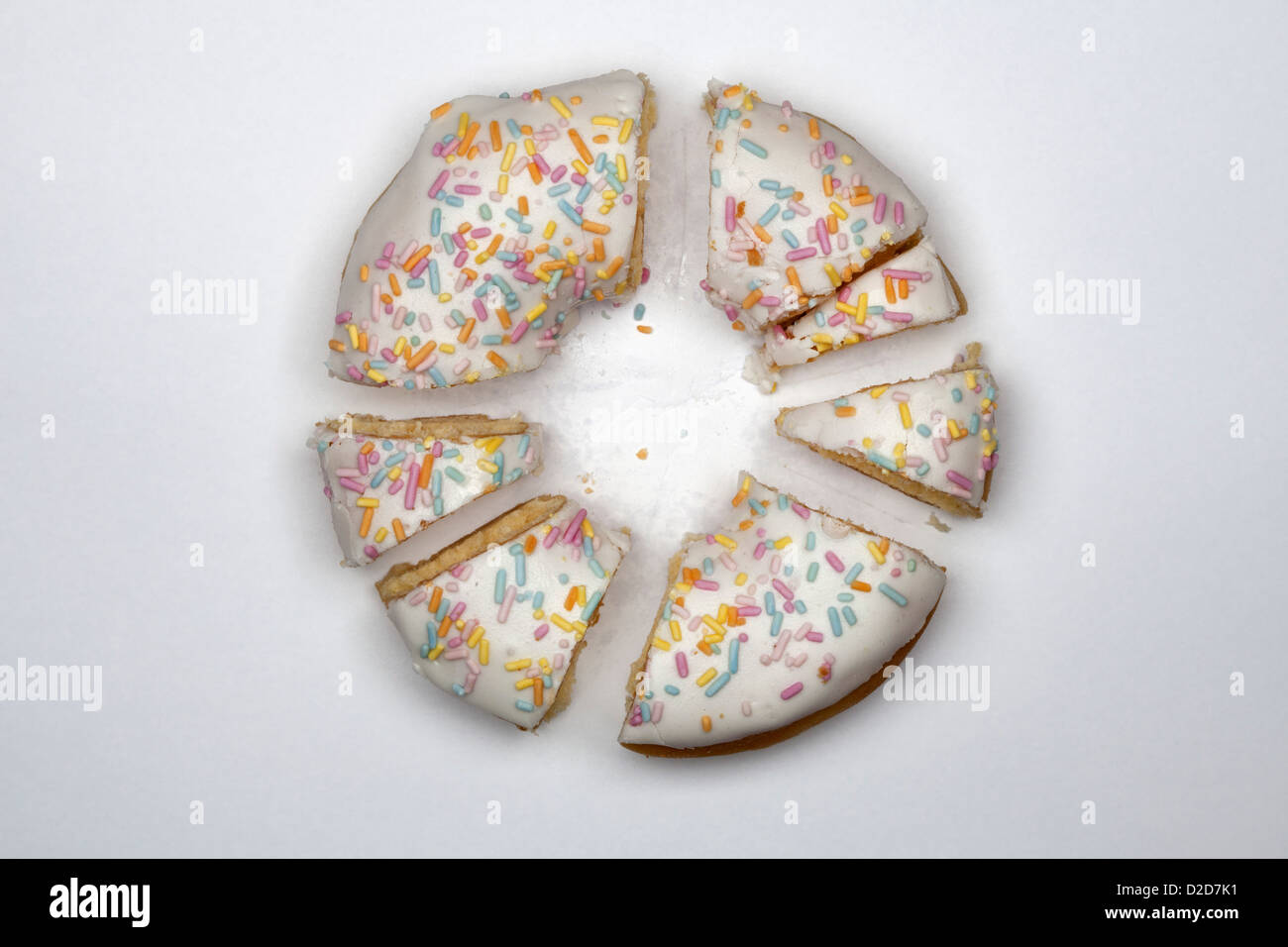 A doughnut cut into pieces Stock Photo - Alamy