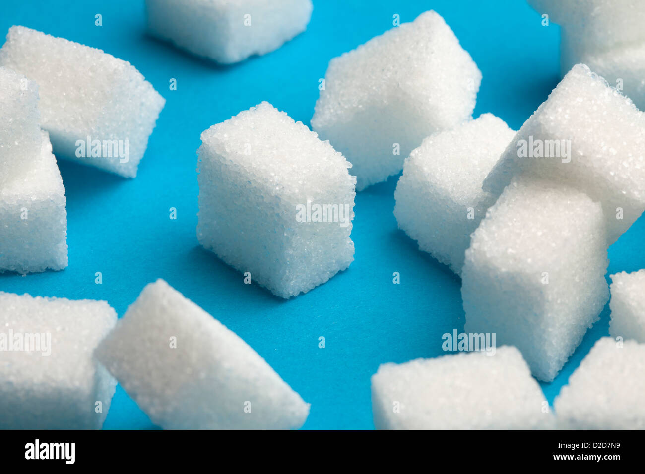 Sugar cubes with one standing out in the middle Stock Photo