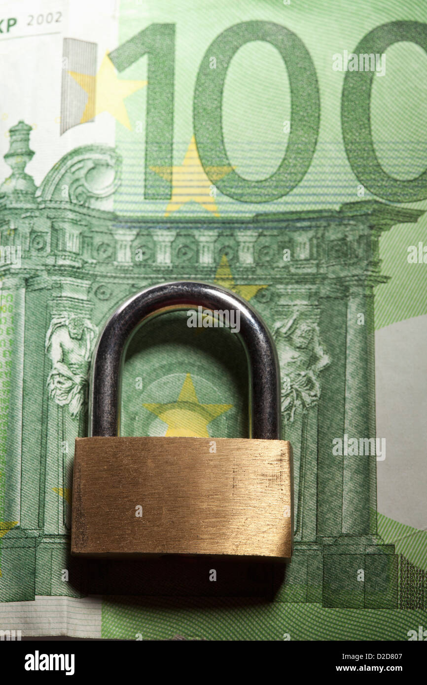Padlock over image of building on 100 euro note Stock Photo