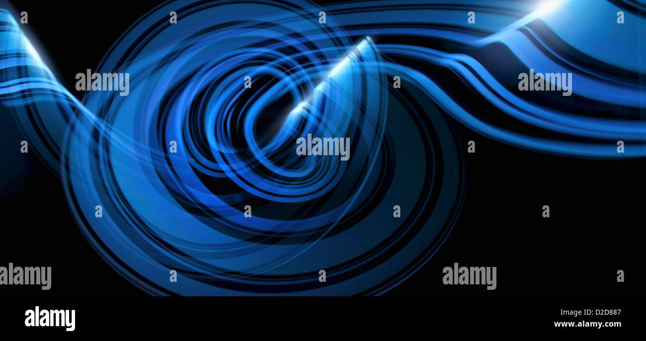 Light trails creating an abstract blue wave pattern on a black ...