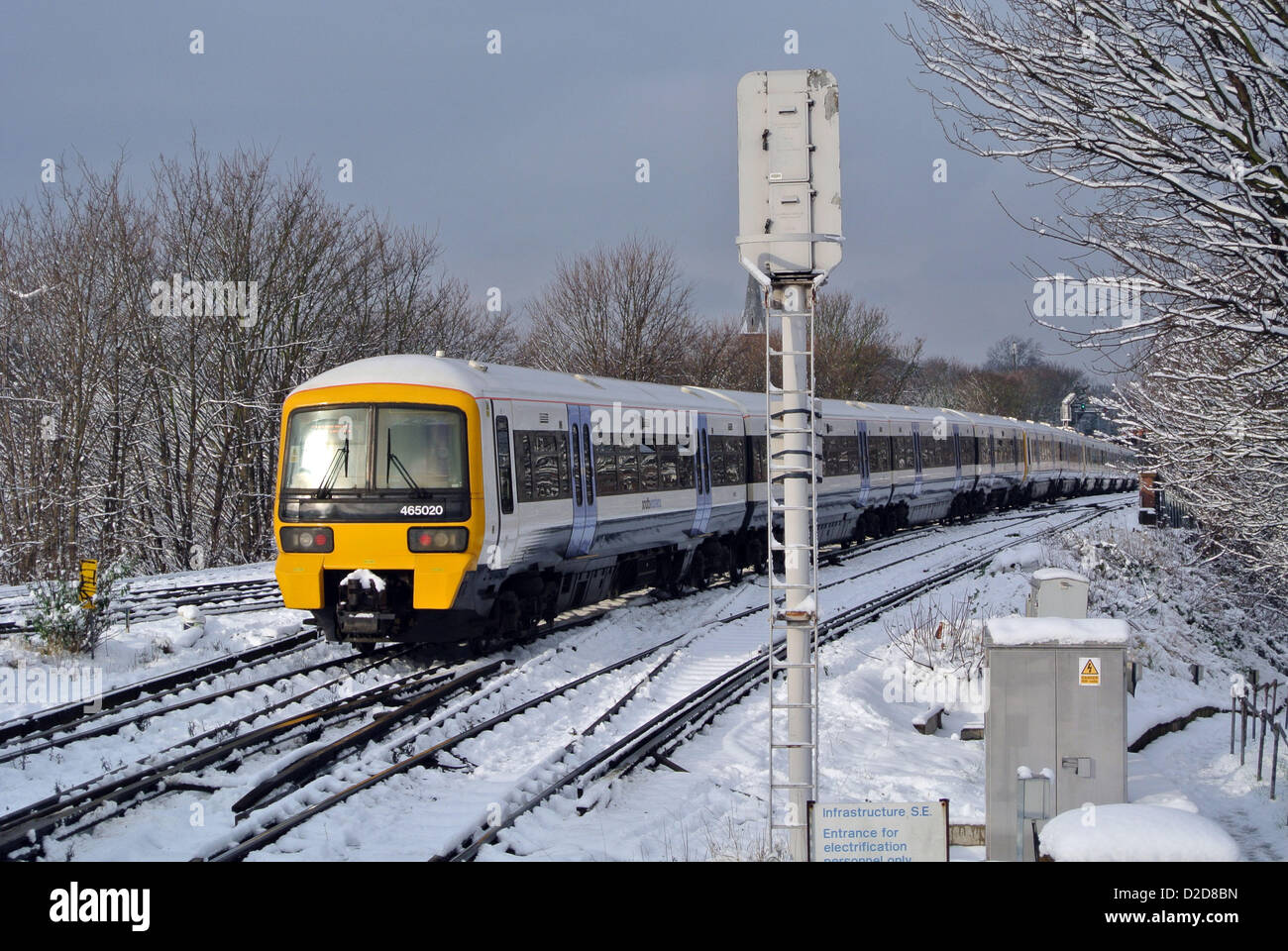 London, UK. 21st January 2013. Snow causes rail travel disruption in London. Snow on the railway track at Lewisham. Stock Photo