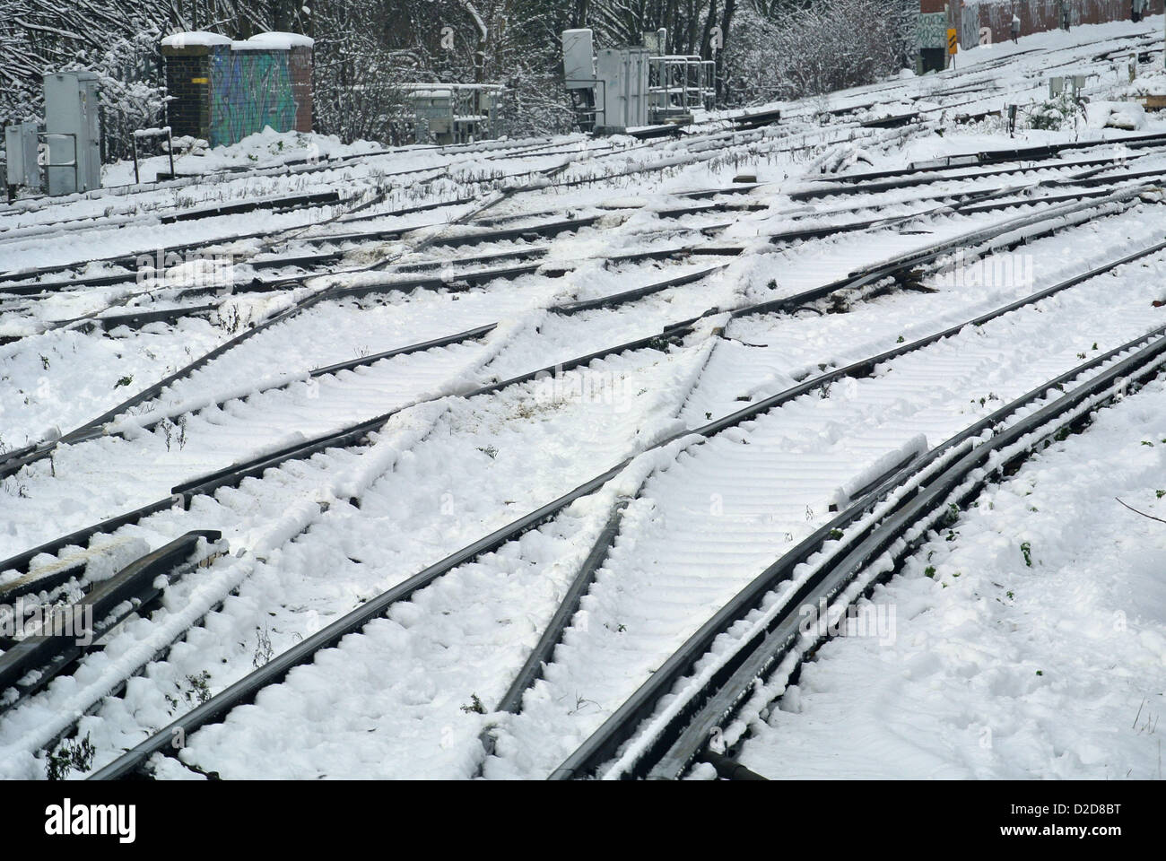 London, UK. 21st January 2013. Snow causes rail travel disruption in London. Snow on the railway track at Lewisham. Stock Photo