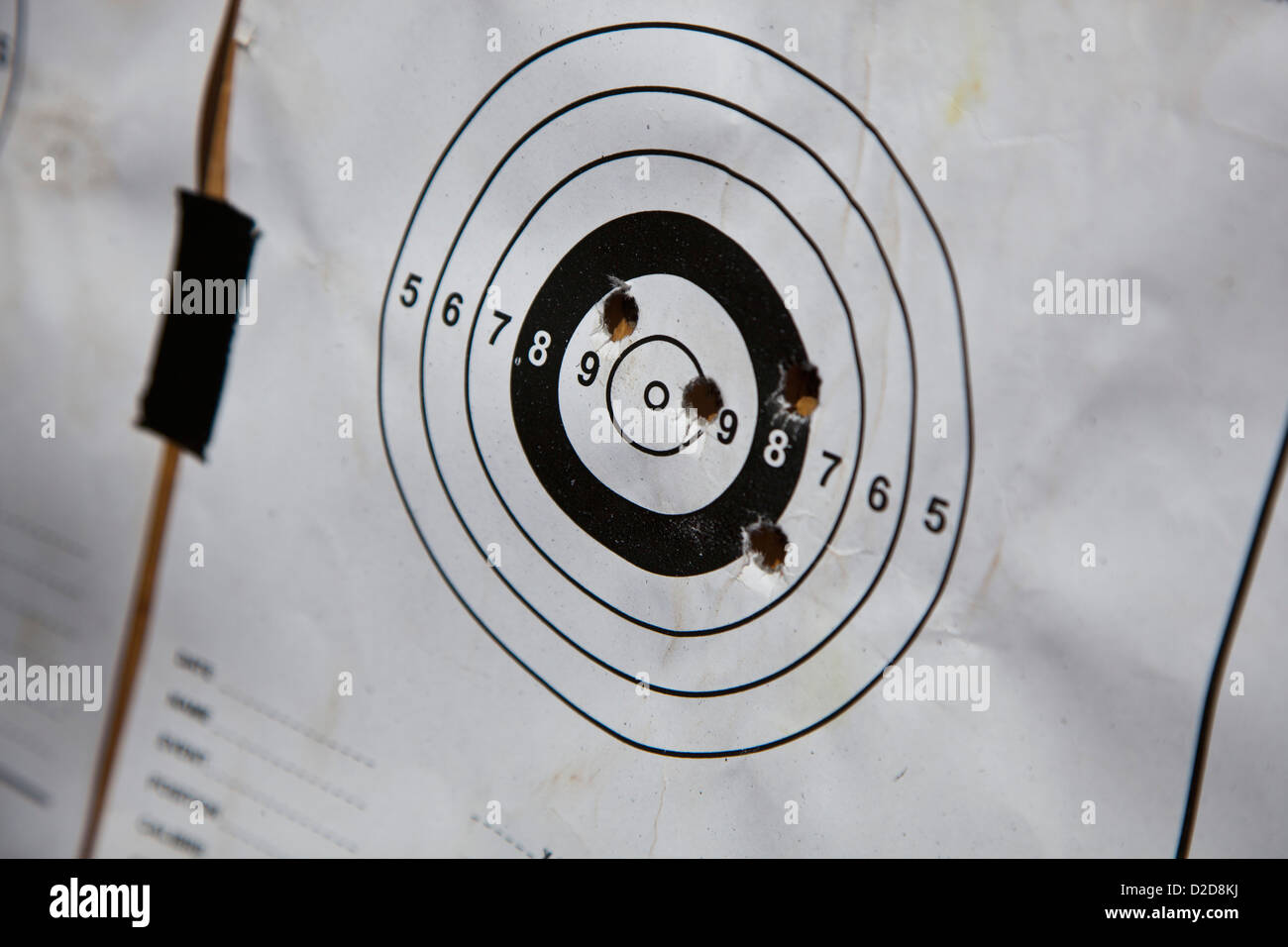 Bullet holes on a paper target Stock Photo