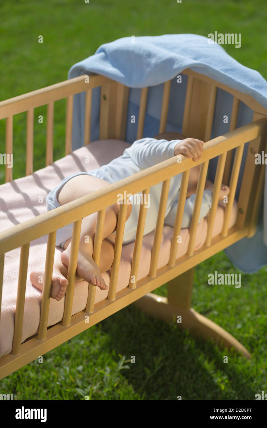 Baby sleeping on back in cot hi-res stock photography and images - Alamy