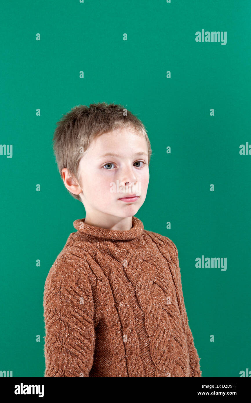 A boy looking seriously into the camera Stock Photo