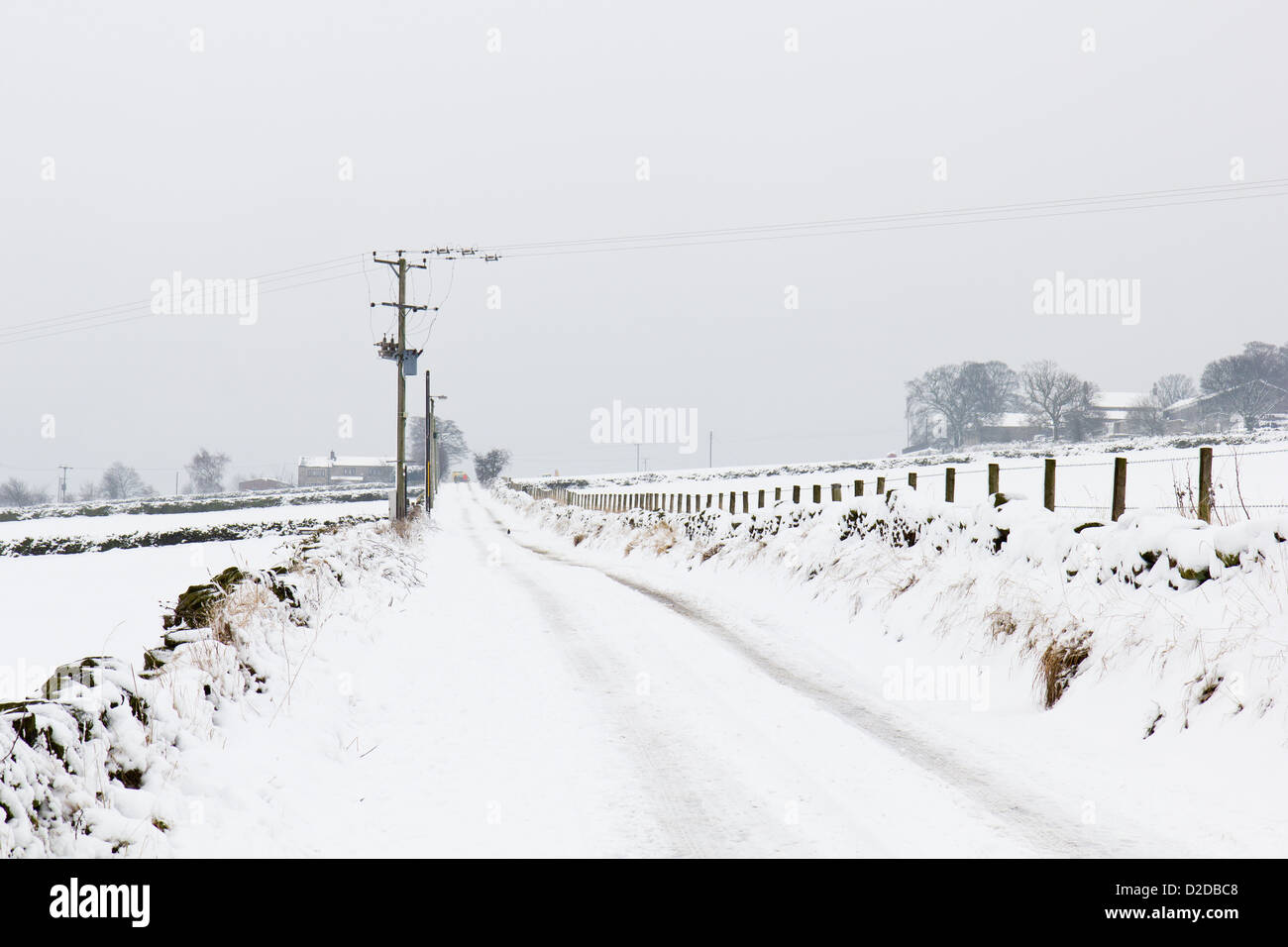 A snow covered road in the Pennines, Kirklees, West Yorkshire Stock Photo