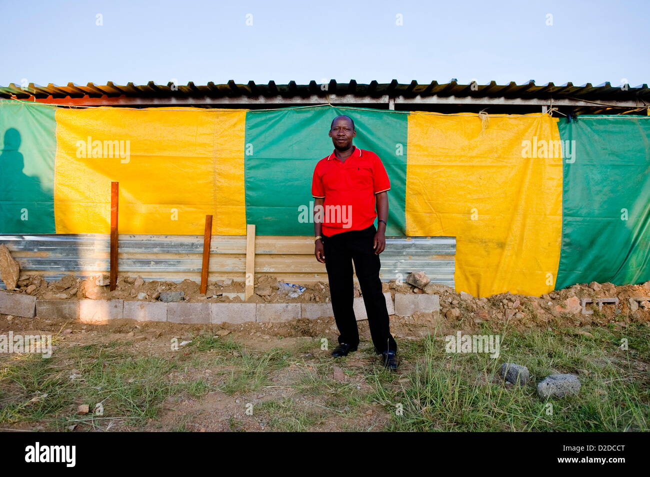 CARLTONVILLE, SOUTH AFRICA: Samuel Motsoanakaba, a mineworker at Harmony Gold’s Kusasalethu Mine stands outside a church on January 17, 2013 in Carltonville, South Africa. About 80 miners found themselves stranded and had to find refuge at a church after they were locked out Kusasalethu's mine hostels. The Kusasalethu shaft has been temporarily shut down due to violence and illegal sit-ins at the mine. (Photo by Gallo Images / City Press / Herman Verwey) Stock Photo