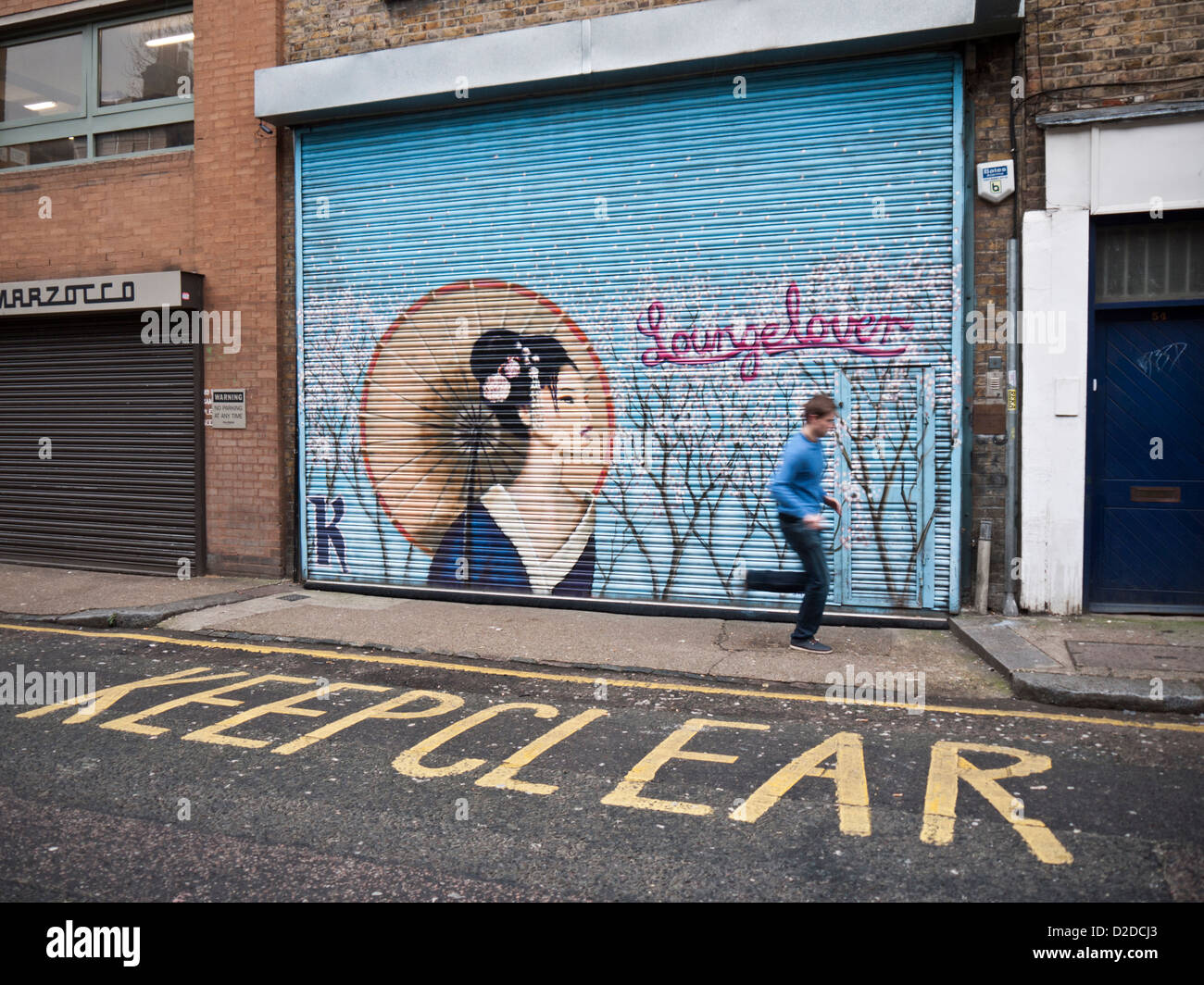 Street art on a shop shutter in Redchurch Street, London by the artist Jimmy C Stock Photo