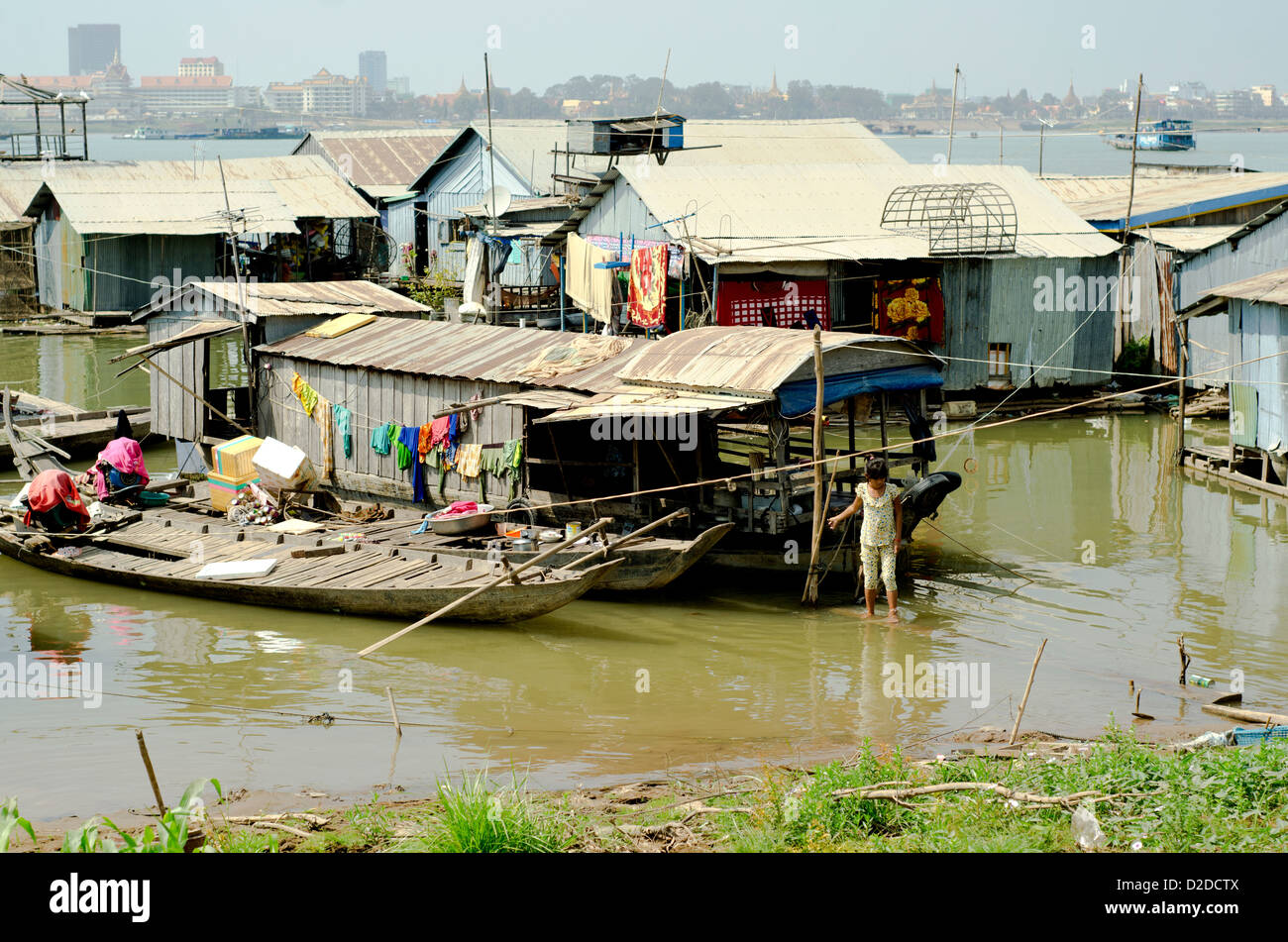 Floating village on Mekong in Phnom Penh. The place is just 500 m from the city most expensive hotels. Stock Photo