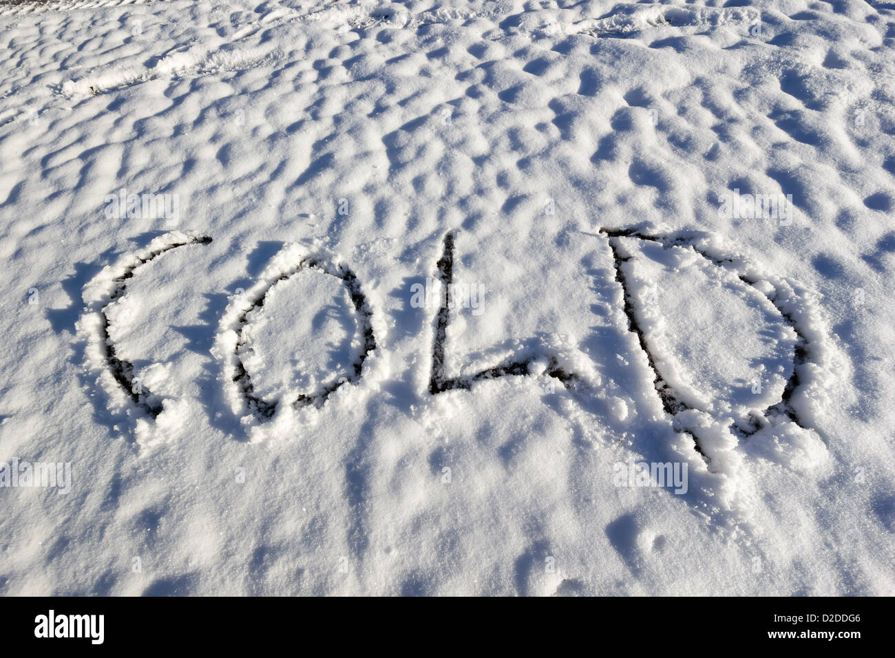 The word "Cold" carved into fresh white snow Stock Photo Alamy
