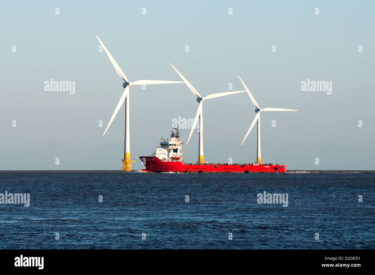 The Durga Devi offshore vessel, in front of the wind turbines on Scroby Sands off the coast of Great Yarmouth, Norfolk, England Stock Photo