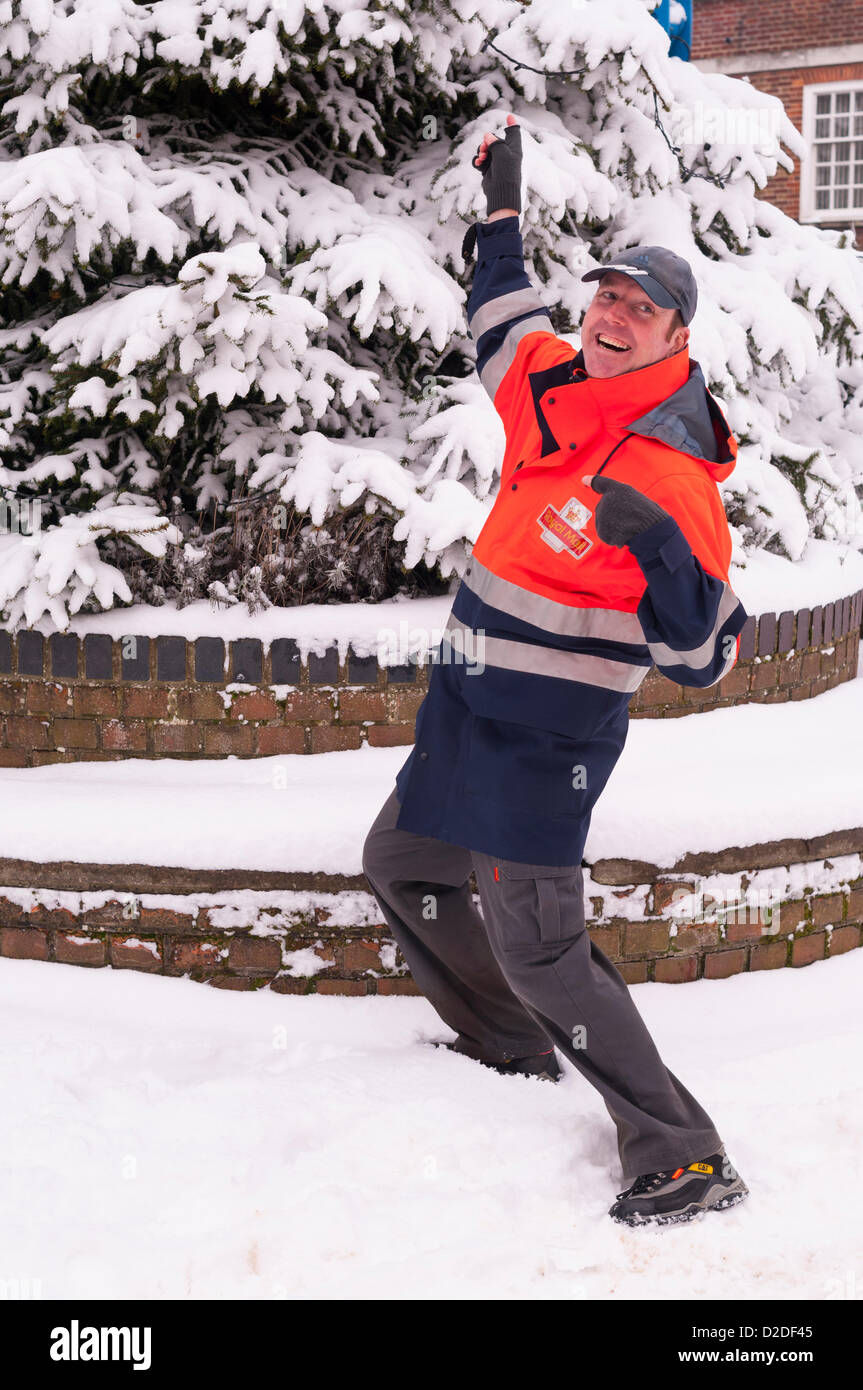 Beccles, Suffolk, UK. 21st January 2013. A Royal Mail postman enjoying the snow in Beccles. Stock Photo