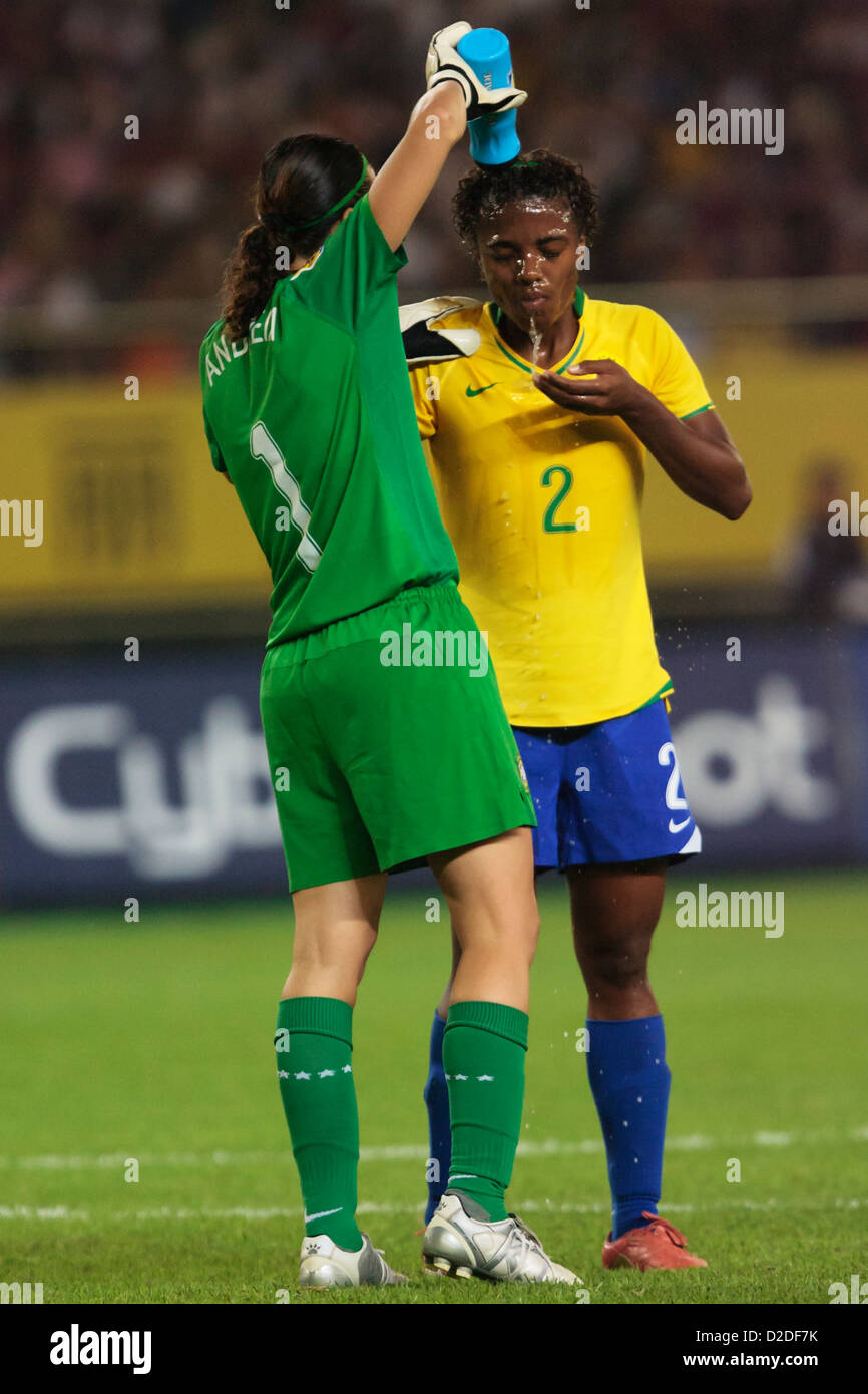 Goalkeeper Andreia of Brazil (L) squirts water over the head of teammate Elaine (R) during a FIFA Women's World Cup match. Stock Photo