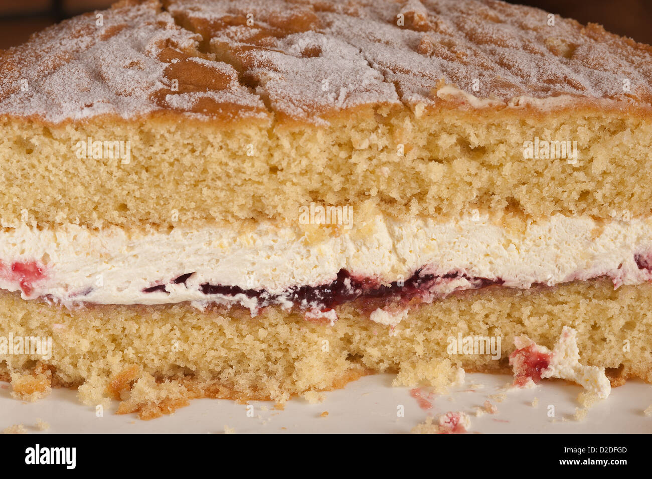 Classic Victoria sandwich traditional homemade sponge cake filled with double cream and jam