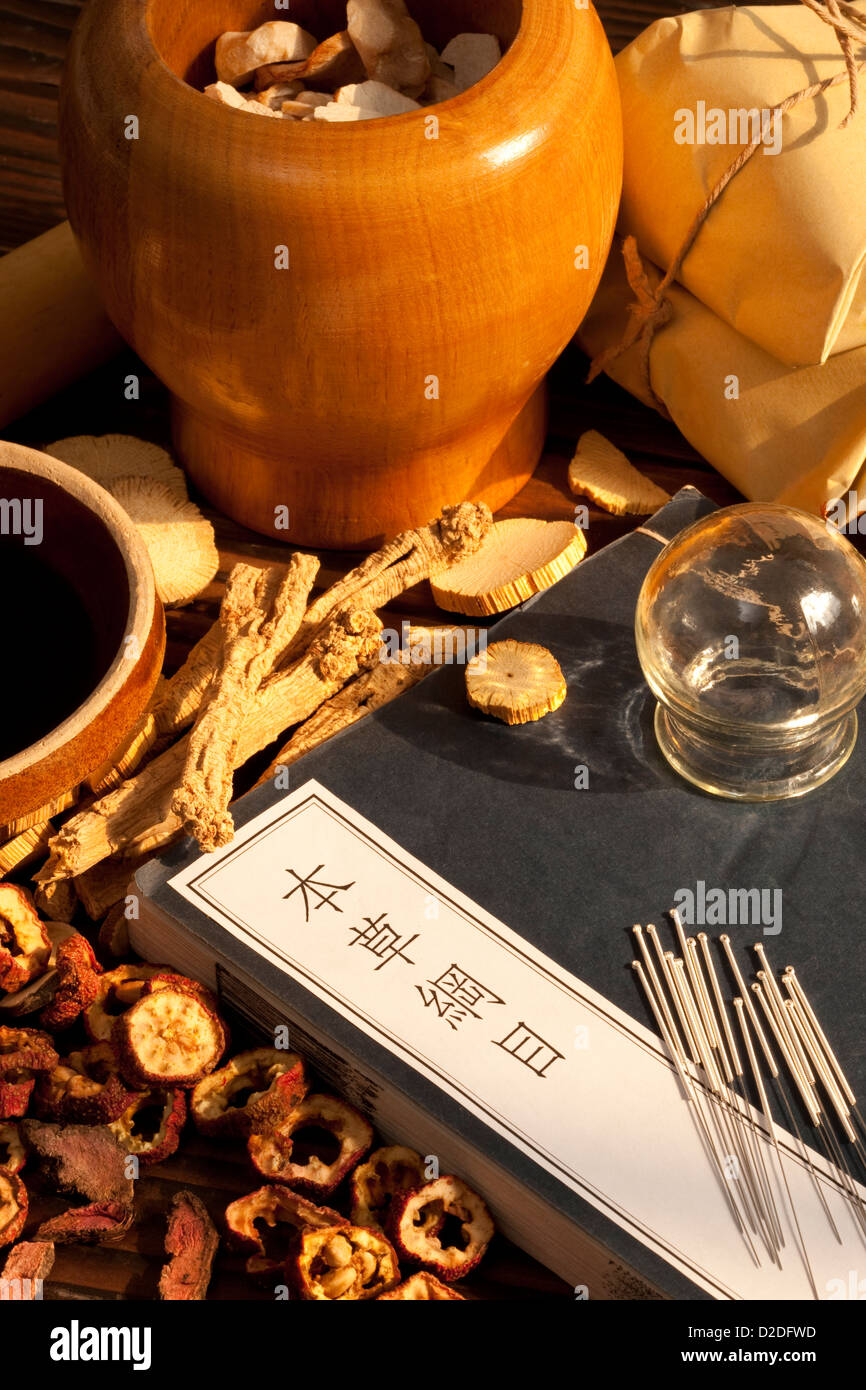 Traditional Chinese herbal medicine therapy with ancient Chinese medical book Stock Photo