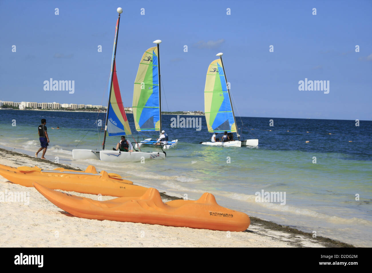 Kayaks and sailing boats, Puerto Morelos, Mexico Stock Photo