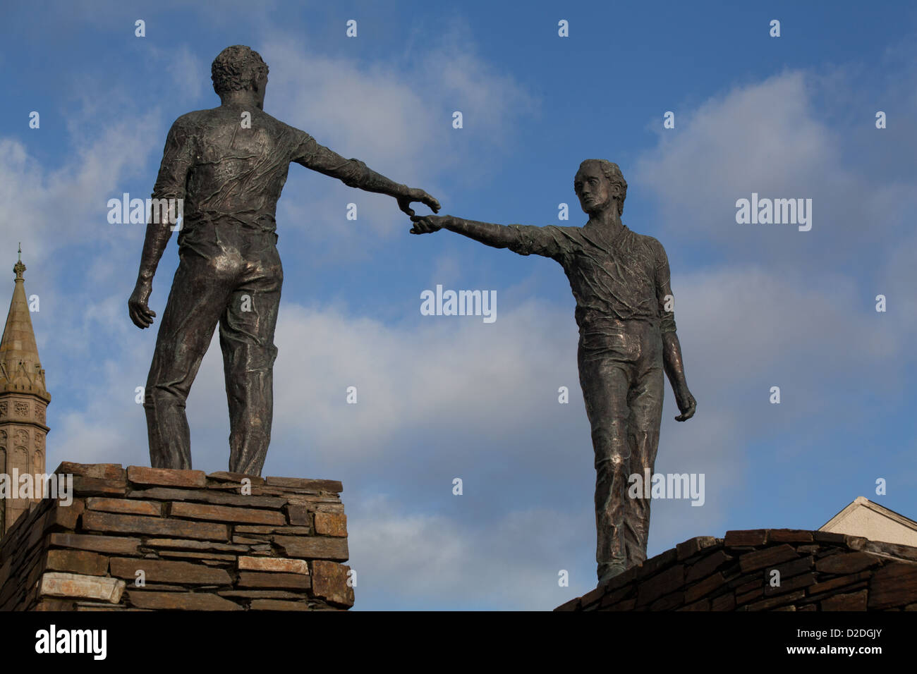 Hands across the divide bronze sculpture by Maurice Harron Derry