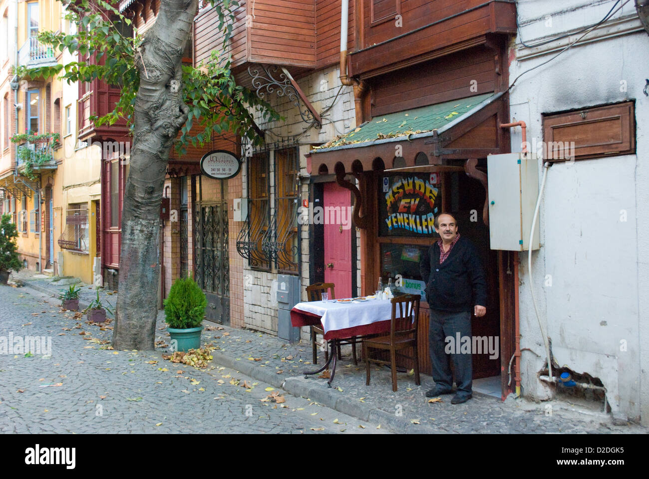 A restaurant owner stands outside his premises in Kuzguncuk, in 'Old Istanbul', famed for its seafood restaurants. Stock Photo