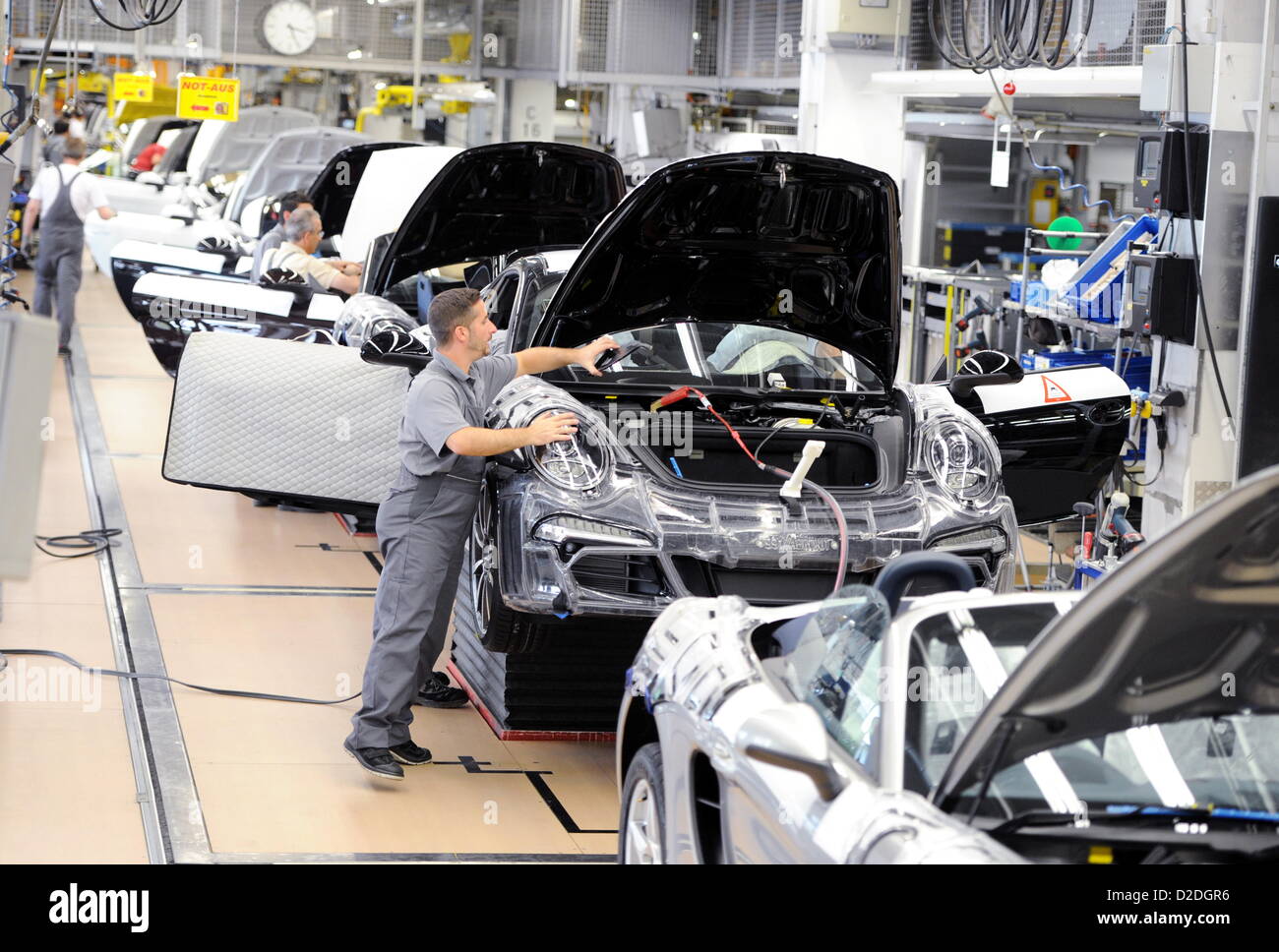 Porsche employees are working on a Porsche Boxster on Monday, 10 September 2012, at the main