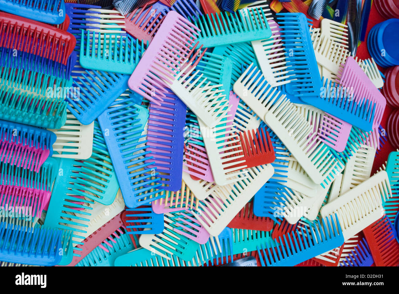Colourful hair combs on sale in market Stock Photo