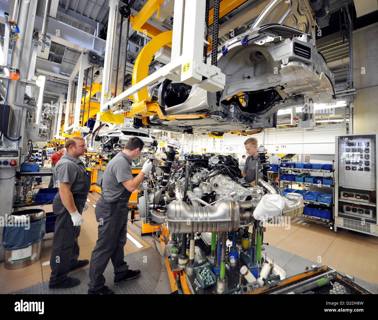 Porsche employees are working on a Porsche Boxster on Monday, 10 September 2012, at the main