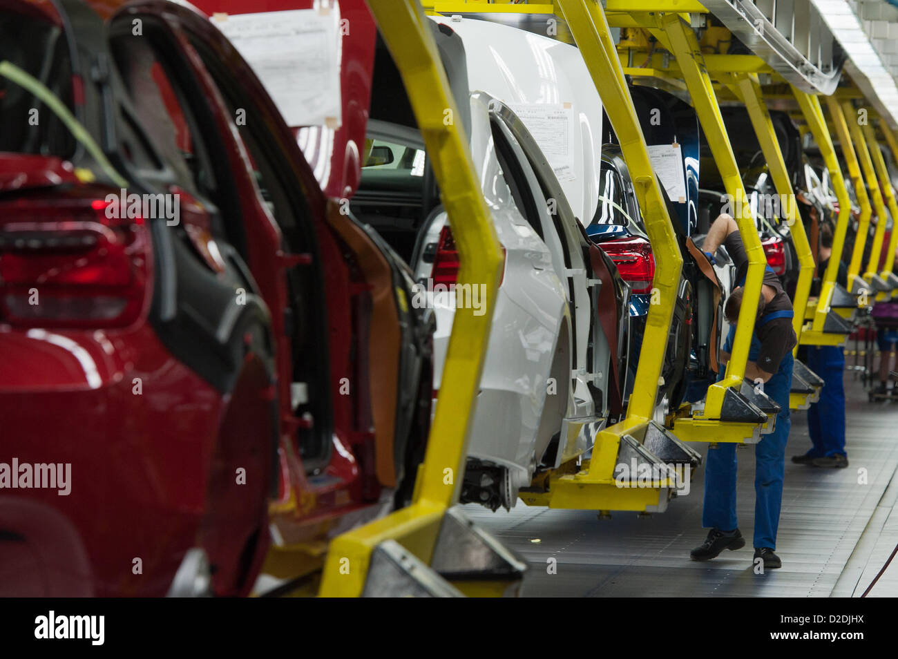 Employees are working on BMW bodies on Wednesday, 7 March 2012, at the BMW factory in Regensburg. Due to a sales record in 2011, the profit of the Bavarian automobile producer also rised in unknown hights. Stock Photo