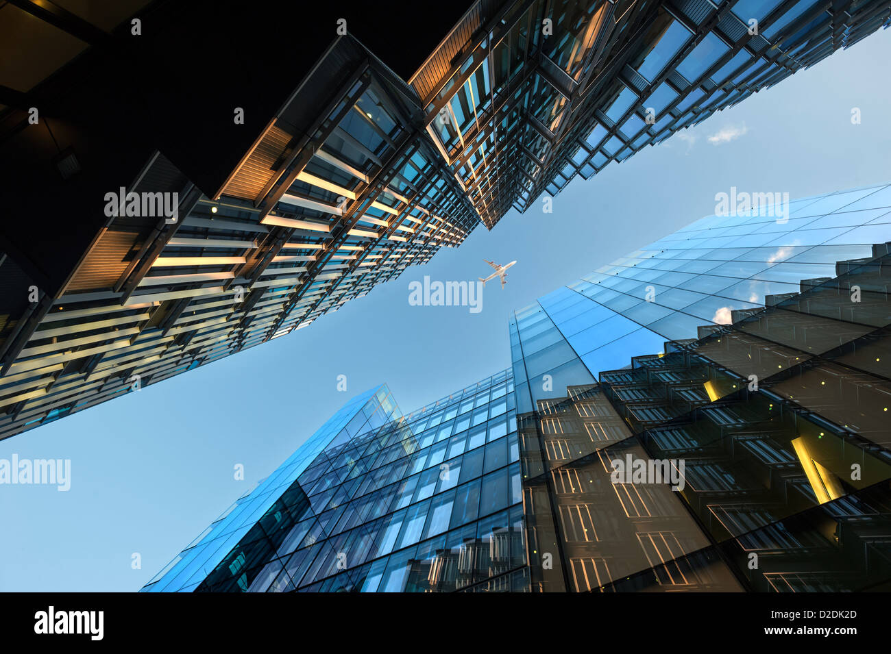 Aircraft Flying over London offices London Stock Photo