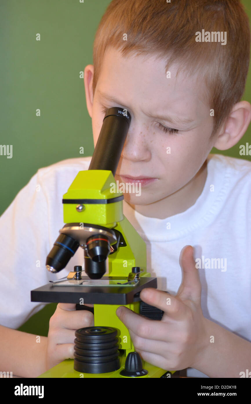 the boy with a microscope Stock Photo