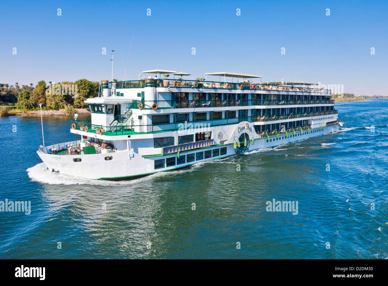 Tourist cruise boat travelling down the River Nile towards Aswan from Luxor Egypt Middle East Stock Photo