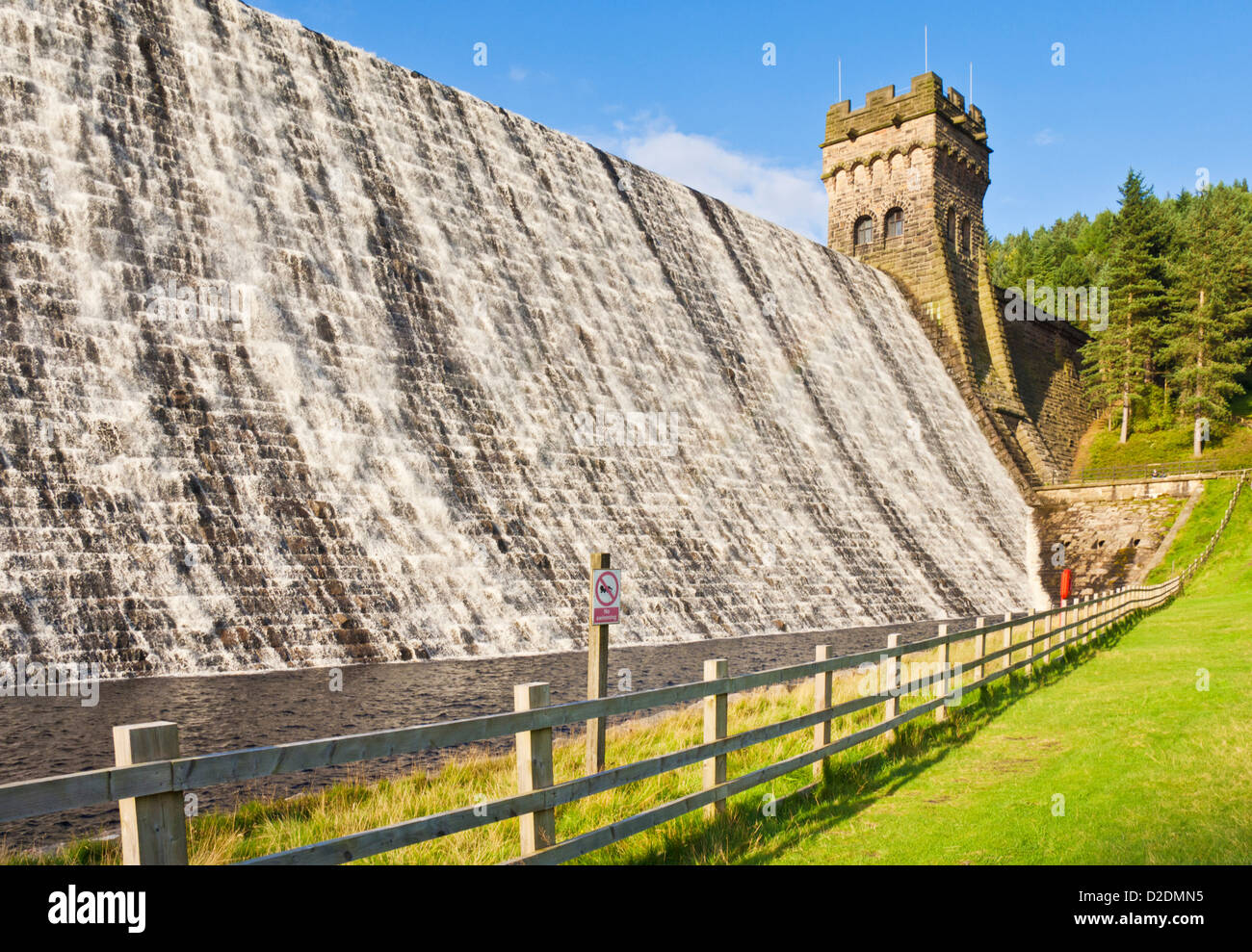 Dam wall with water overflowing Derwent reservoir Derbyshire Peak district national park Derbyshire England UK GB EU Europe Stock Photo