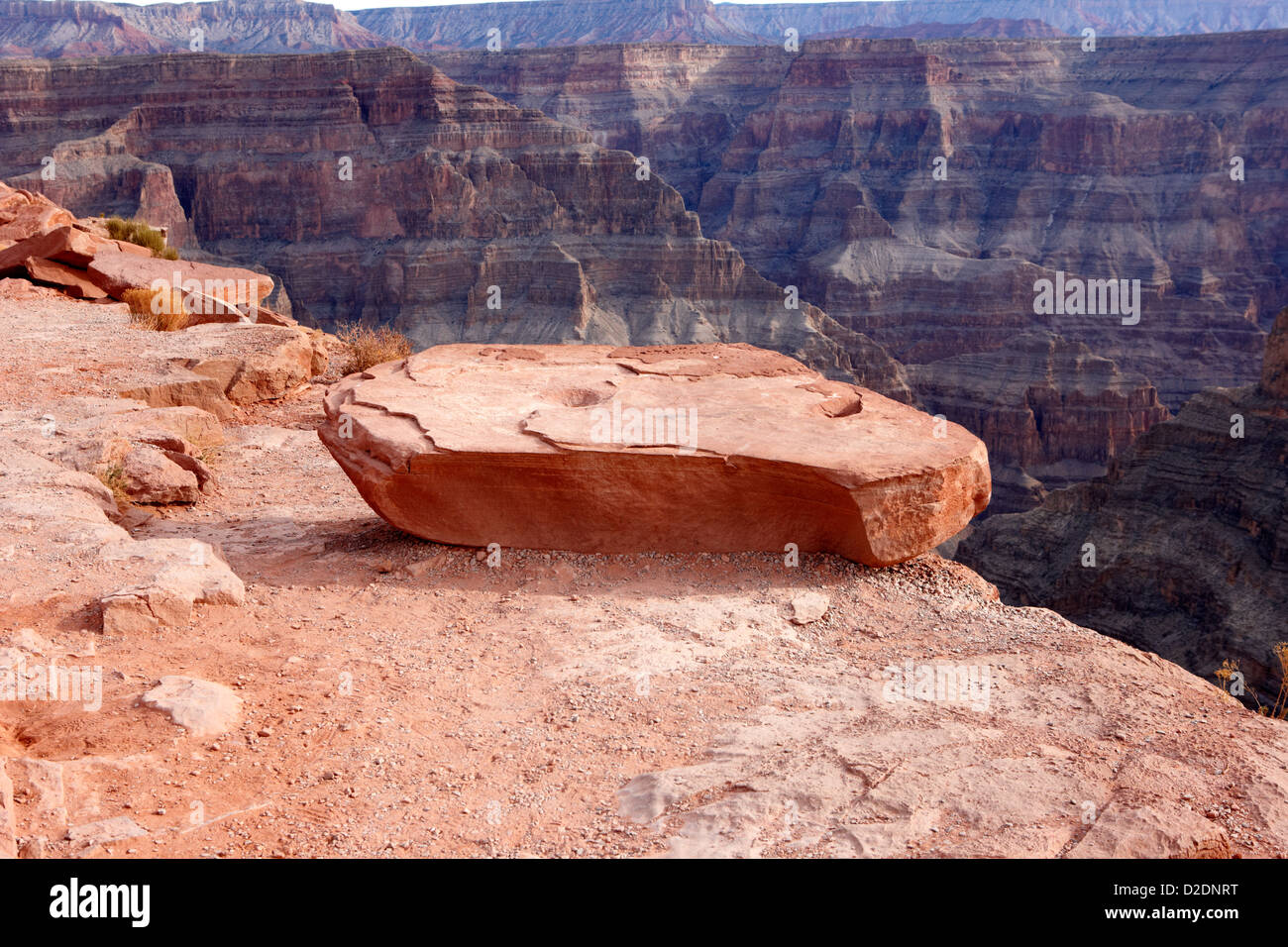 large flat rock on the edge of the rim of grand canyon guano point Grand Canyon west arizona usa Stock Photo