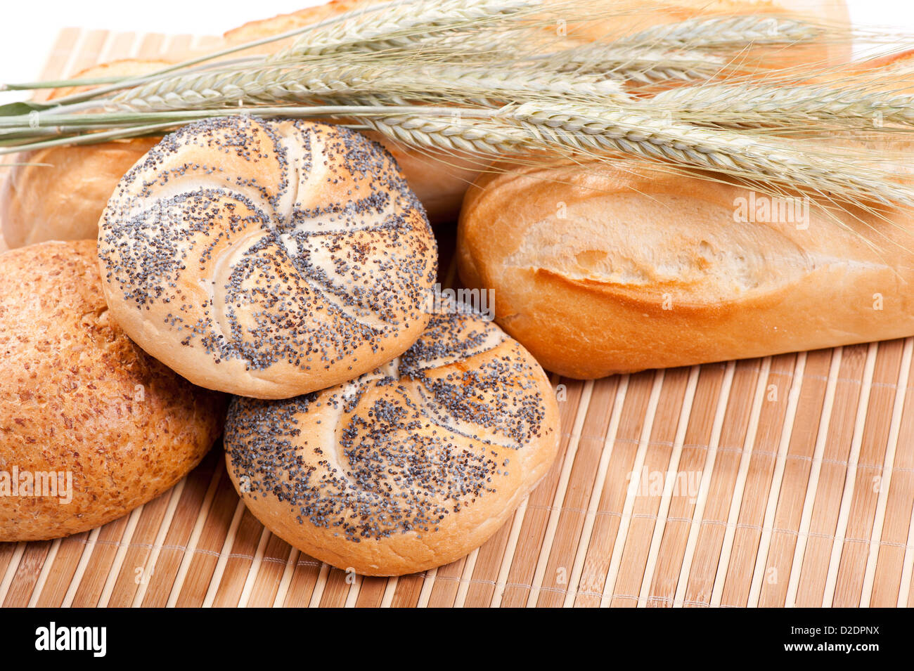 kaiser rolls with poppy seeds and cereal ears Stock Photo - Alamy