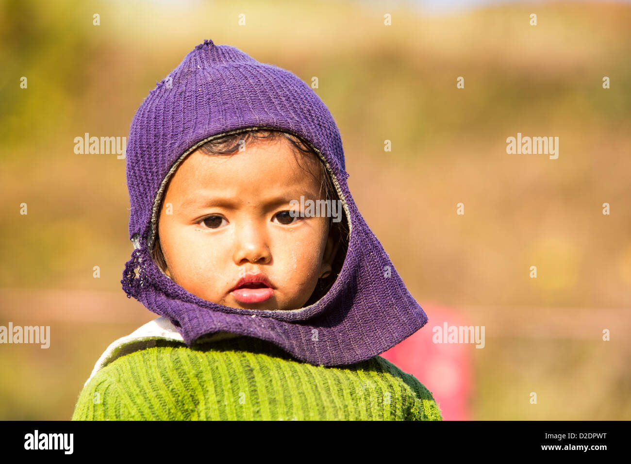 A Nepalese child in traditional clothing in the Himalayan foothills