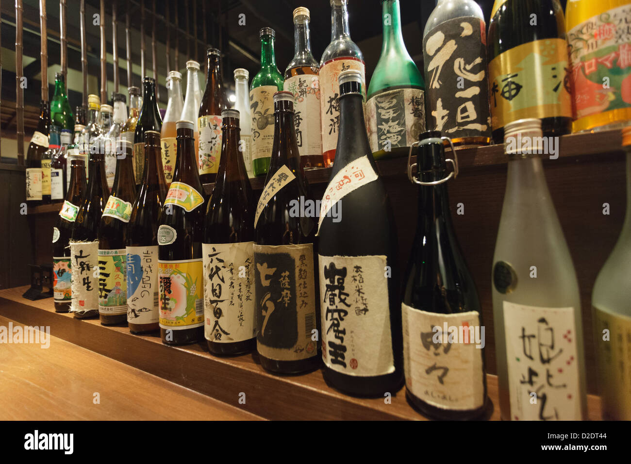 Row of traditional Japanese liqueurs in a restaurant, Kyoto, Japan