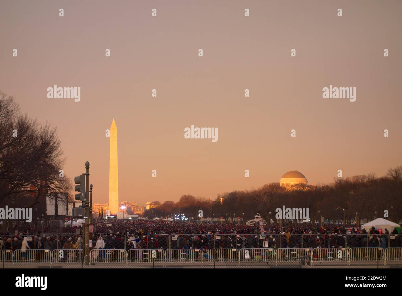 Washington DC. January 21, 2013,  A large crowd gathers on the National Mall for the inaugural ceremony. President Barack Obama, officially sworn in to a second term yesterday due to a constitutional requirement, takes a ceremonial oath of office today. Stock Photo