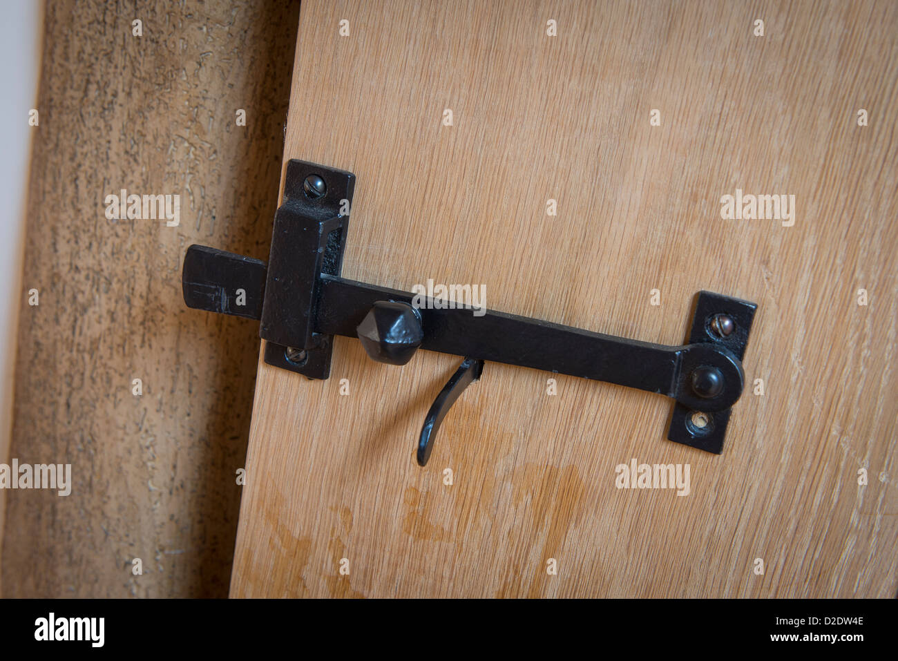 Metal latch on a door in a newly converted barn in rural england Stock