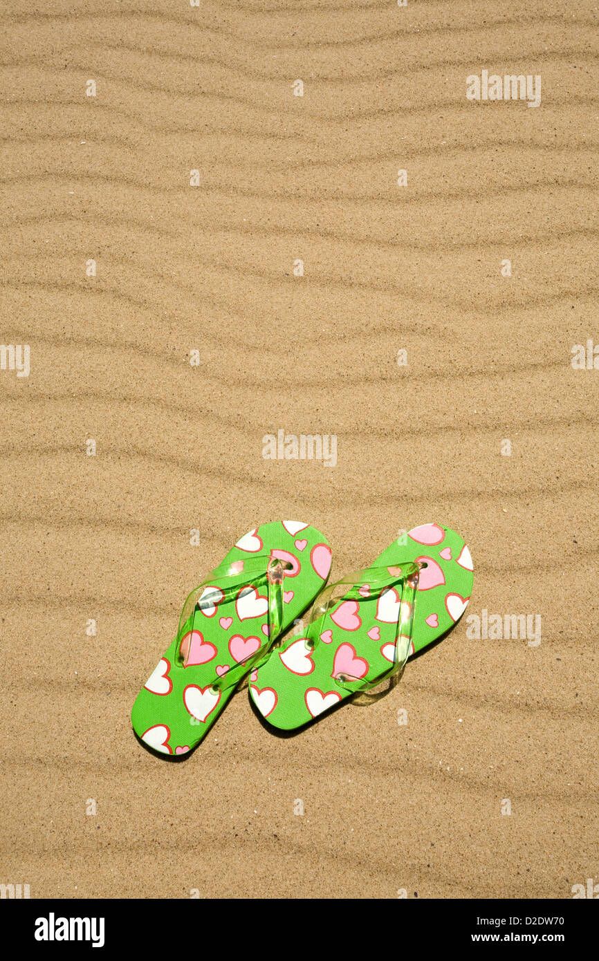 flip flops on beach sand Stock Photo - Alamy