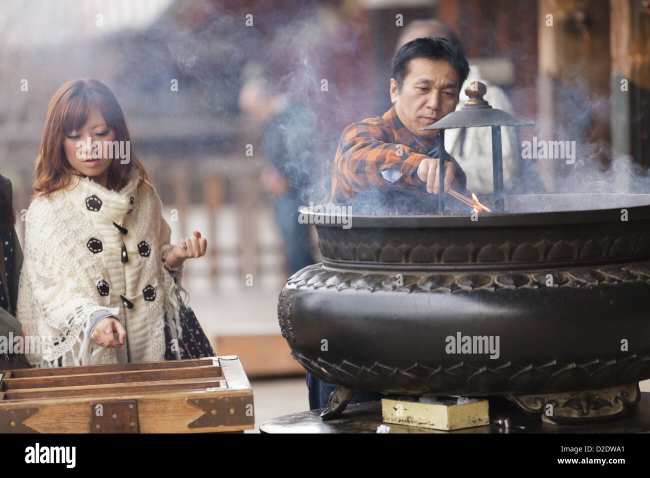 Japanese people burning incense stick and praying at the Todaiji
